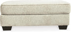 Signature Design by Ashley Rectangular Ottoman, Sandstone Beige | Firmly cushioned 100% polyester chenille fabric, Generous 44-inch scale for coffee table or lounge use, Monaghan Series