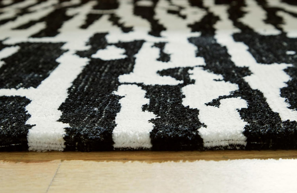 Signature Design by Ashley Area Rug, Abstract 10x14, Black/Ivory | Extra large modern abstract rug with medium 9 mm pile, 100% polyester for spacious living rooms, Bramshaw Series