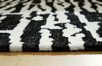 Signature Design by Ashley Area Rug, Abstract 10x14, Black/Ivory | Extra large modern abstract rug with medium 9 mm pile, 100% polyester for spacious living rooms, Bramshaw Series