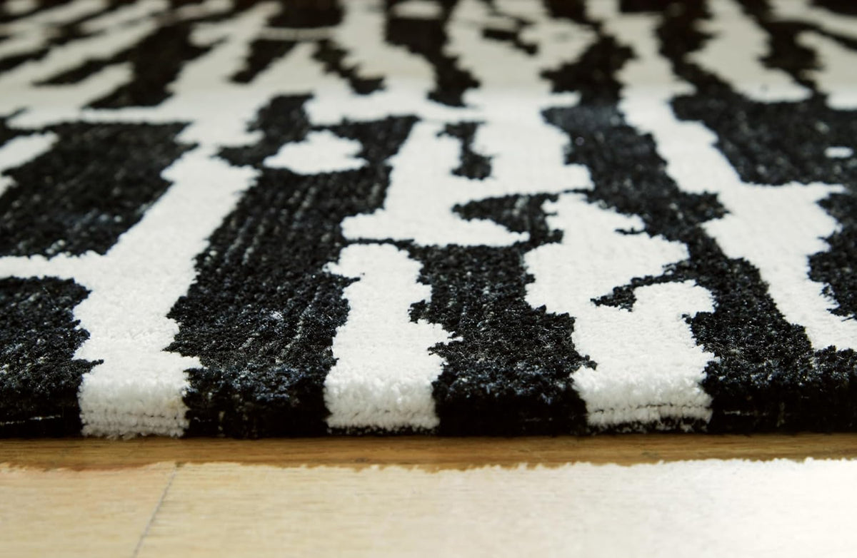 Signature Design by Ashley Area Rug, Abstract 10x14, Black/Ivory | Extra large modern abstract rug with medium 9 mm pile, 100% polyester for spacious living rooms, Bramshaw Series
