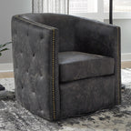Signature Design by Ashley Swivel Black Faux Leather Accent Chair | Elegant tufted faux leather with brass nailheads, Hidden metal swivel base for effortless conversation, Brentlow Series