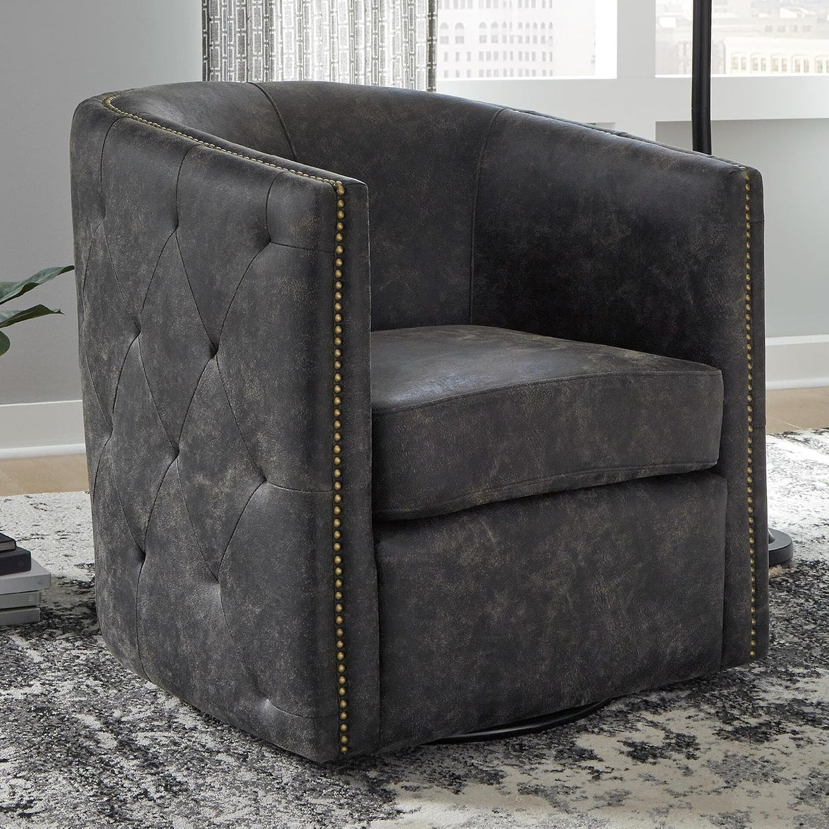 Signature Design by Ashley Swivel Black Faux Leather Accent Chair | Elegant tufted faux leather with brass nailheads, Hidden metal swivel base for effortless conversation, Brentlow Series