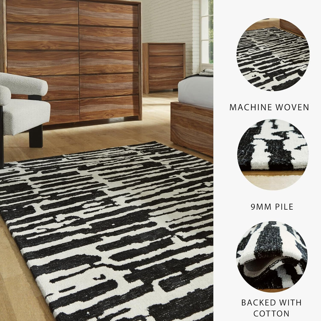 Signature Design by Ashley Bramshaw Area Rug, 5x7, Black and White | Soft 9 mm pile for underfoot comfort, High-contrast abstract pattern, Durable machine-woven polyester