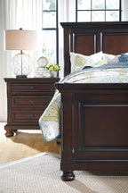 Signature Design by Ashley Porter Traditional Wood Nightstand, Brown | Veneers, wood and engineered wood, 2 smooth-operating drawers, Hidden pull-out tray, Felt bottom, Bun feet