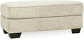 Signature Design by Ashley Rectangular Ottoman, Sandstone Beige | Firmly cushioned 100% polyester chenille fabric, Generous 44-inch scale for coffee table or lounge use, Monaghan Series