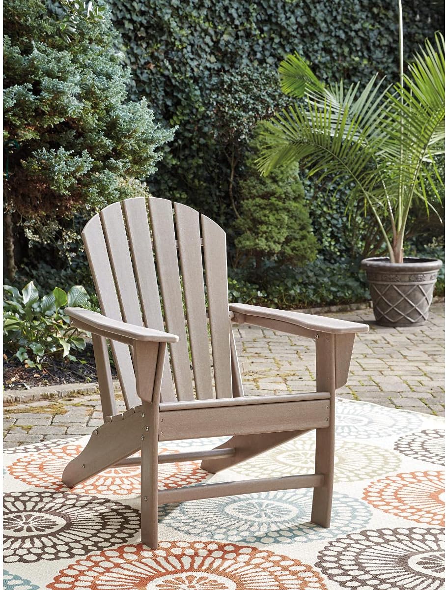 Signature Design by Ashley 1-Piece HDPE Outdoor Adirondack Chair, Driftwood | Durable weather resistant HDPE, 36-pound stationary frame, Comfortable 16.25-inch elevated seat, Sundown Treasure Series