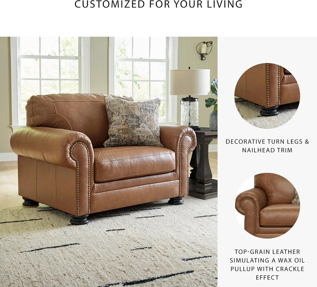 Signature Design by Ashley Carianna Oversized Leather Accent Chair, Caramel | Top-grain leather seating, Durable faux leather outer panels, Extra-wide 54 in frame, Traditional living room style