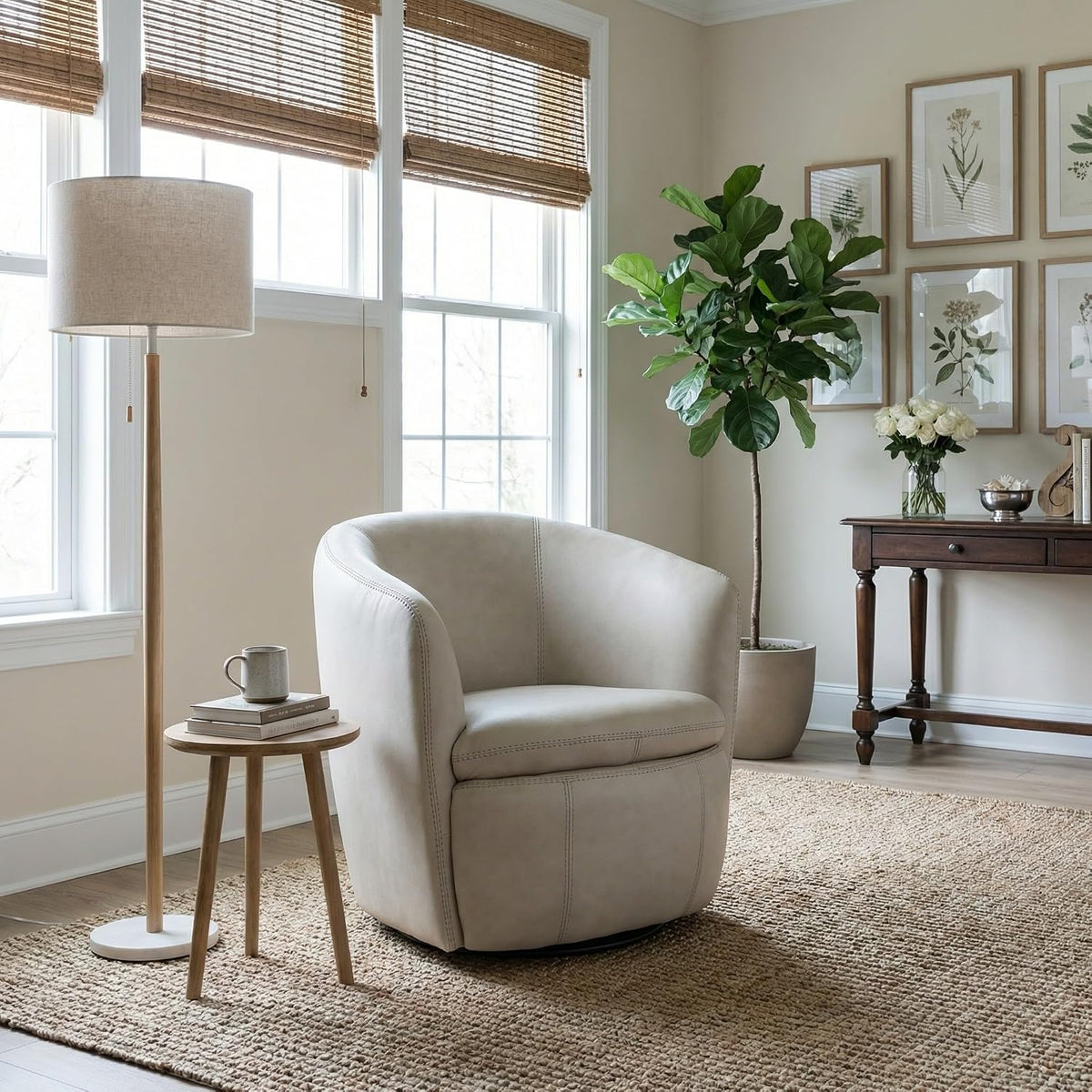 Signature Design by Ashley Kierreys Leather Swivel Barrel Chair, Bone | 100% top grain leather upholstery, 360-degree metal base rotation, Engineered wood and metal frame, Contemporary barrel back