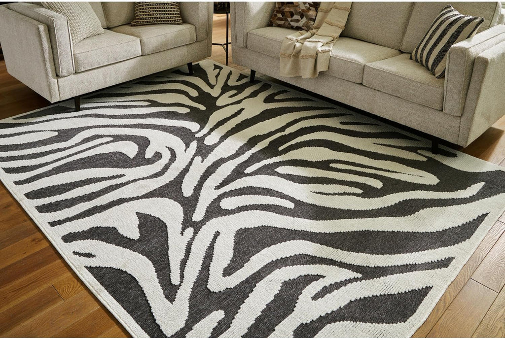 Signature Design by Ashley Thomwith Contemporary Indoor Washable Zebra Design 8 x 10 Rug with Non Slip Backing, Black & White