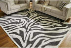 Signature Design by Ashley Thomwith Contemporary Indoor Washable Zebra Design 8 x 10 Rug with Non Slip Backing, Black & White