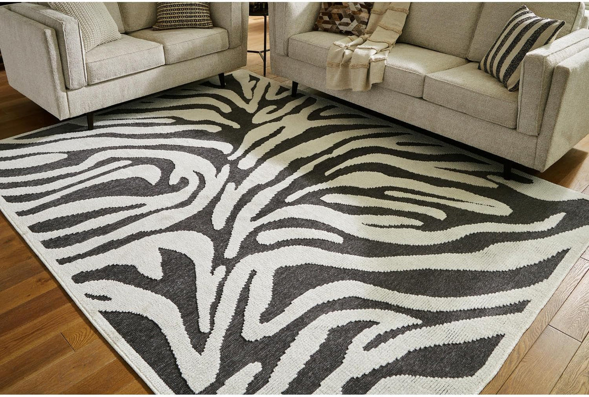Signature Design by Ashley Thomwith Contemporary Indoor Washable Zebra Design 8 x 10 Rug with Non Slip Backing, Black & White