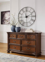Signature Design by Ashley 7-Drawer Wood Bedroom Dresser, Wide Chest, Brown | Felt-lined top drawers for delicate protection, Sturdy 205 lb frame for master bedroom storage, Lavinton Series