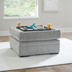 Signature Design by Ashley Square Ottoman with Storage and Cup Holders | Cement gray 100% polyester velvet, No assembly required, Faux wood legs, Casselbury Series