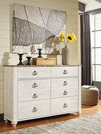 Signature Design by Ashley Willowton 6-Drawer Coastal Dresser, Whitewash | 6 drawer capacity, Coastal farmhouse style, Textured whitewash finish, Driftwood plank effect top, ASTM F 2057 compliant