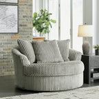 Signature Design by Ashley Lindyn Oversized Round Swivel Accent Chair, Fog | Plush textured cord upholstery, Sag-resistant platform foundation, Reversible seat cushion, No assembly required