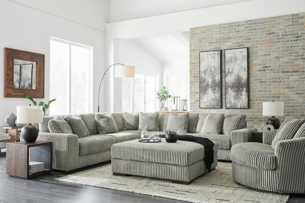 Signature Design by Ashley Lindyn Oversized Round Swivel Accent Chair, Fog | Plush textured cord upholstery, Sag-resistant platform foundation, Reversible seat cushion, No assembly required