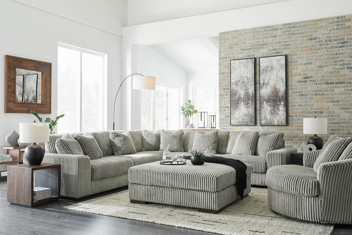 Signature Design by Ashley Lindyn Oversized Round Swivel Accent Chair, Fog | Plush textured cord upholstery, Sag-resistant platform foundation, Reversible seat cushion, No assembly required