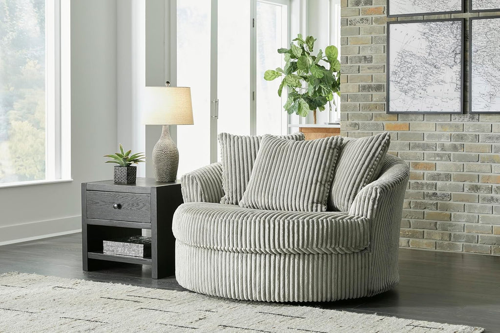 Signature Design by Ashley Lindyn Oversized Round Swivel Accent Chair, Fog | Plush textured cord upholstery, Sag-resistant platform foundation, Reversible seat cushion, No assembly required