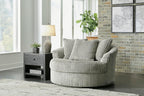 Signature Design by Ashley Lindyn Oversized Round Swivel Accent Chair, Fog | Plush textured cord upholstery, Sag-resistant platform foundation, Reversible seat cushion, No assembly required