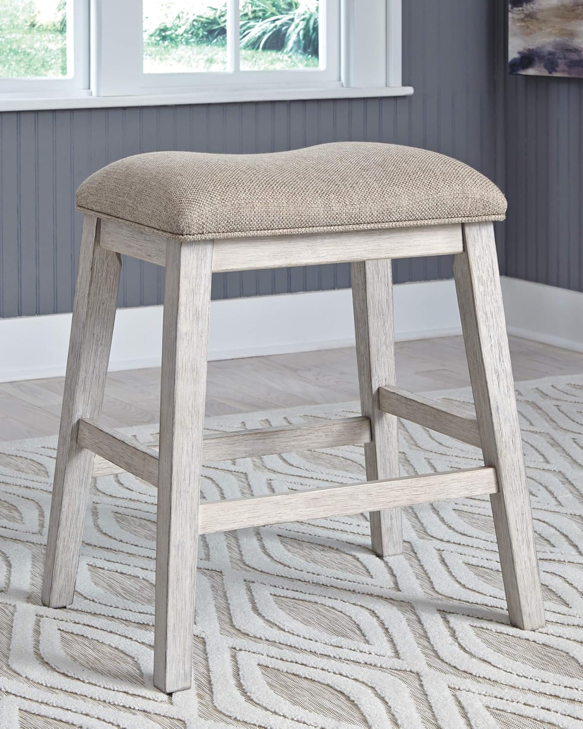 Signature Design by Ashley Skempton Counter Height Bar Stool, Set of 2 | Space-saving 24-inch farmhouse design, Supportive 18.5-inch foam-cushioned saddle seat, Distressed wood frame with footrest