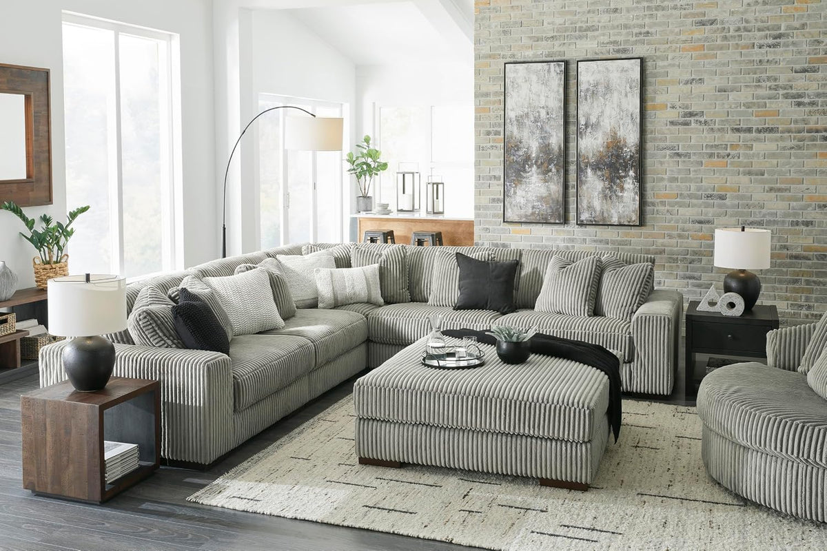 Signature Design by Ashley Lindyn Oversized Round Swivel Accent Chair, Fog | Plush textured cord upholstery, Sag-resistant platform foundation, Reversible seat cushion, No assembly required