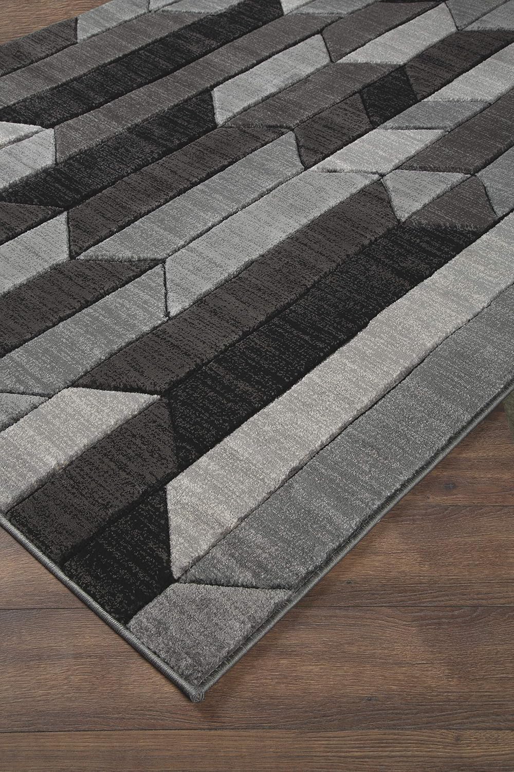 Signature Design by Ashley Chayse Geometric Area Rug, 7x10, Black & Gray | 100% polypropylene fiber, 12 mm medium pile height, Hand-carved multidimensional design, Large living room use, Spot clean