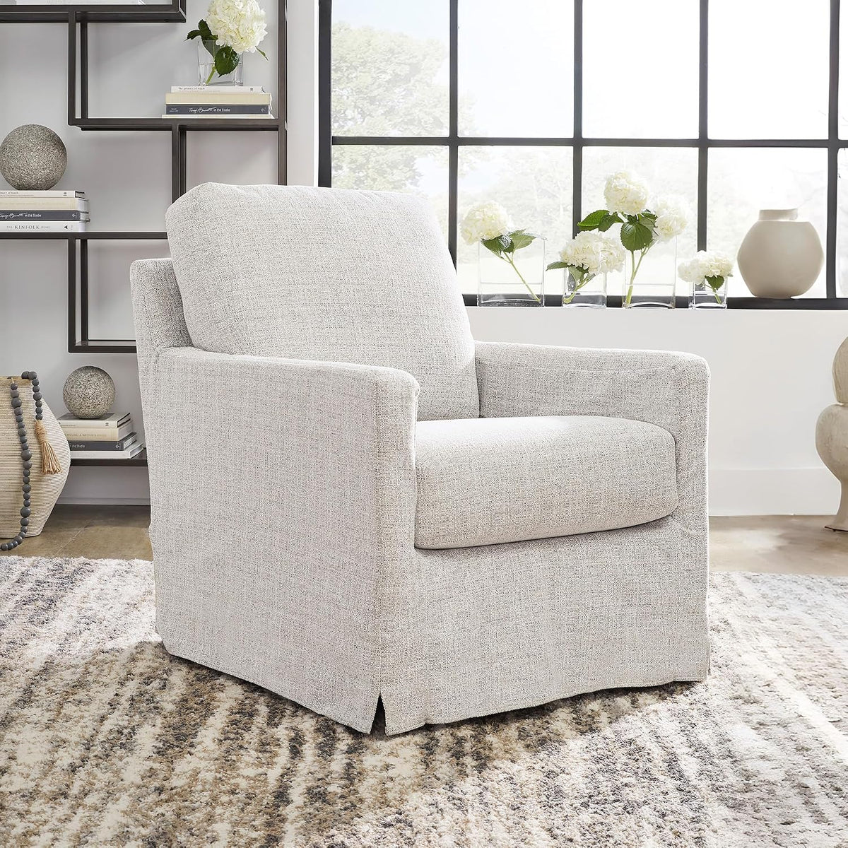 Signature Design by Ashley Nenana Swivel Glider Accent Chair, Stone Beige | Next-Gen Nuvella fabric, Machine-washable covers, 360-degree metal swivel base with gentle gliding motion
