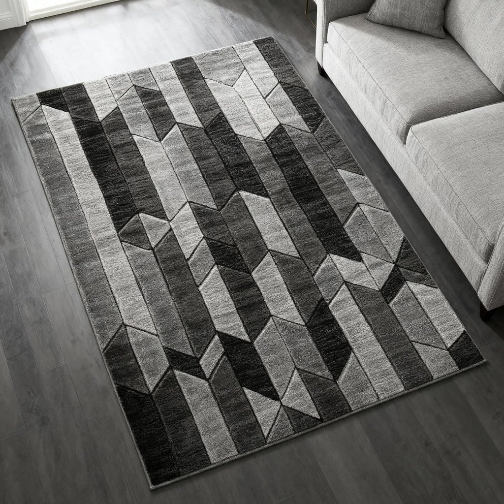 Signature Design by Ashley Chayse Geometric Area Rug, 7x10, Black & Gray | 100% polypropylene fiber, 12 mm medium pile height, Hand-carved multidimensional design, Large living room use, Spot clean