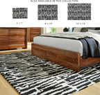 Signature Design by Ashley Bramshaw Area Rug, 8x10, Black and Ivory | Plush 9 mm medium-pile polyester, Protective woven cotton backing, Contemporary high-contrast pattern