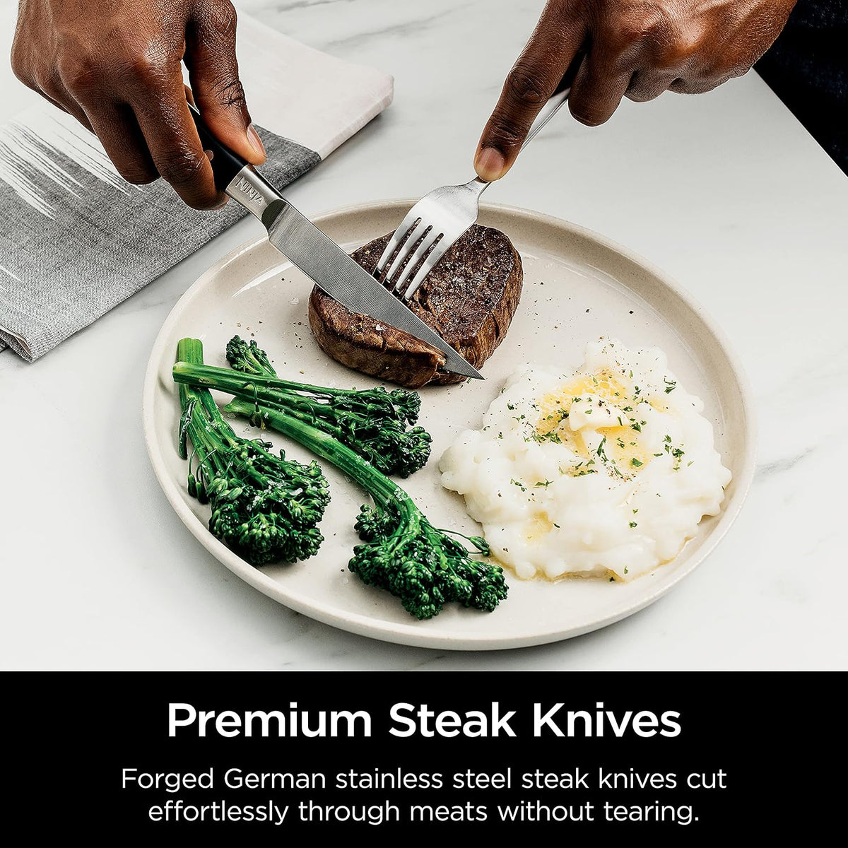 Ninja® Never Dull™ 14-Pc Knife System, Built-in Sharpener, Black, K32014 | Stays razor-sharp 10+ years. German stainless steel blades. A few swipes of the foolproof sharpener restores a superior edge.