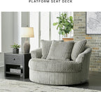 Signature Design by Ashley Lindyn Oversized Round Swivel Accent Chair, Fog | Plush textured cord upholstery, Sag-resistant platform foundation, Reversible seat cushion, No assembly required