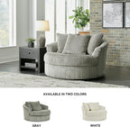 Signature Design by Ashley Lindyn Oversized Round Swivel Accent Chair, Fog | Plush textured cord upholstery, Sag-resistant platform foundation, Reversible seat cushion, No assembly required